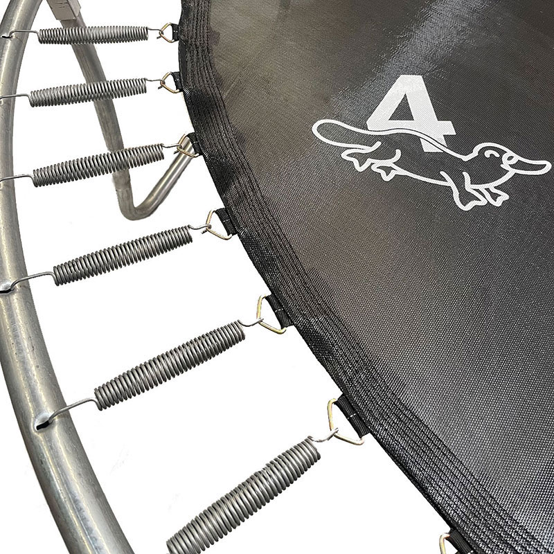 Close-up of a black trampoline mat with a white number 4. Springs are visible.